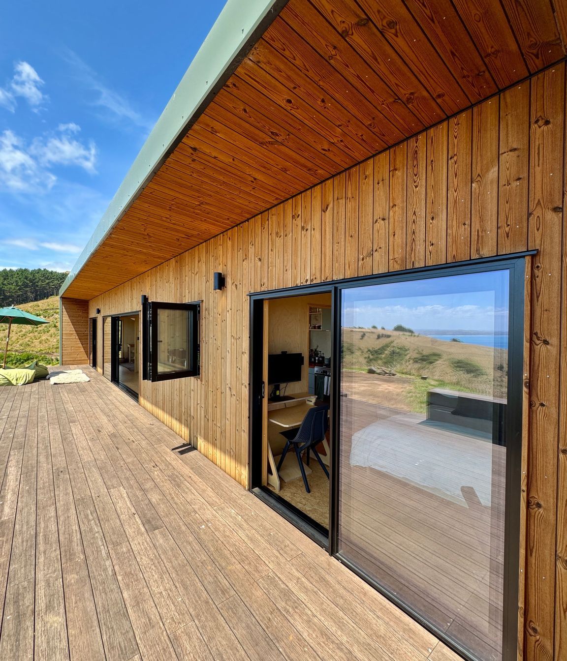 Designer soffit with vertical Nordic Pine cladding and Bamboo decking