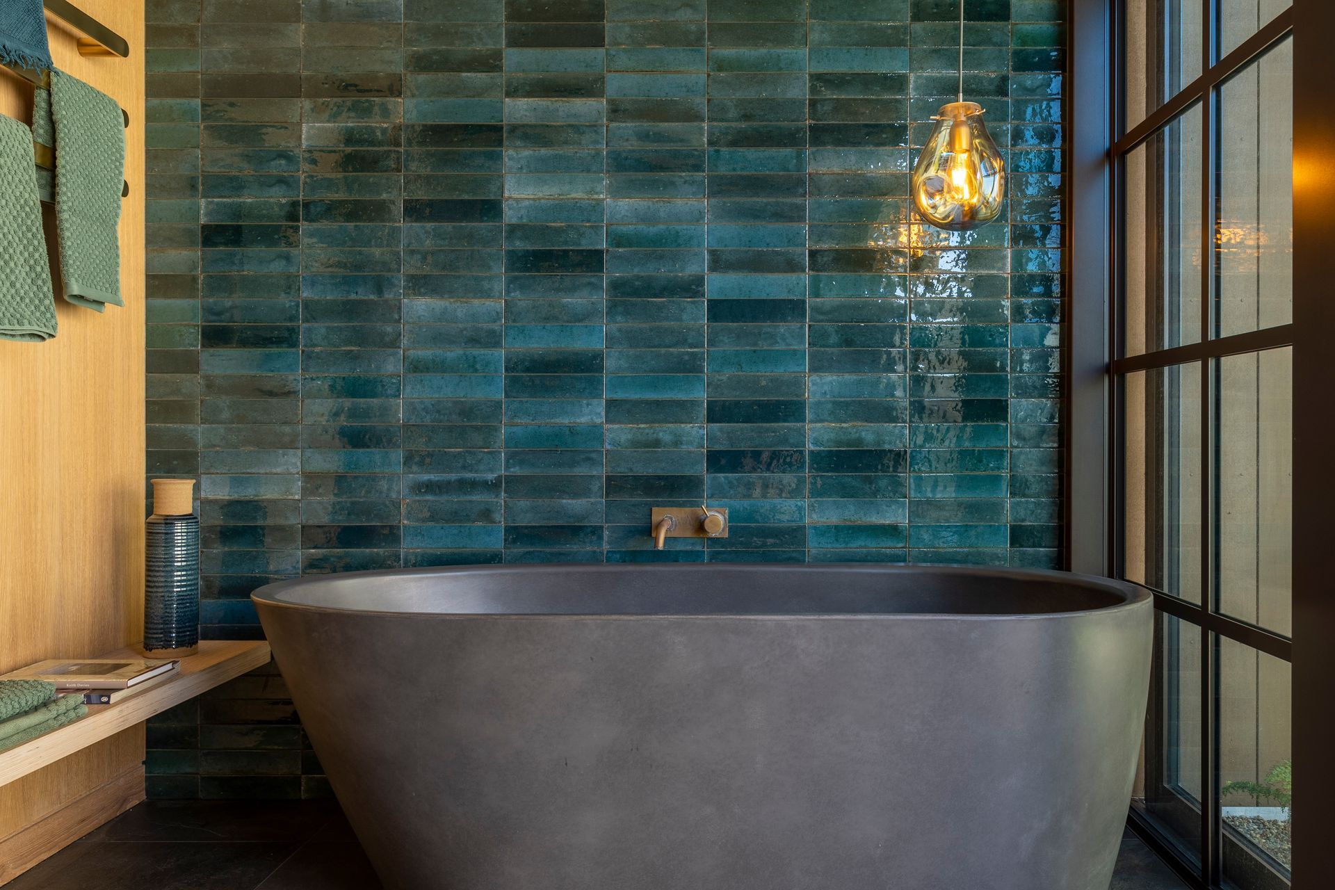 Blue-green tiles mimic the colour of the kingfishers that frequent the property.