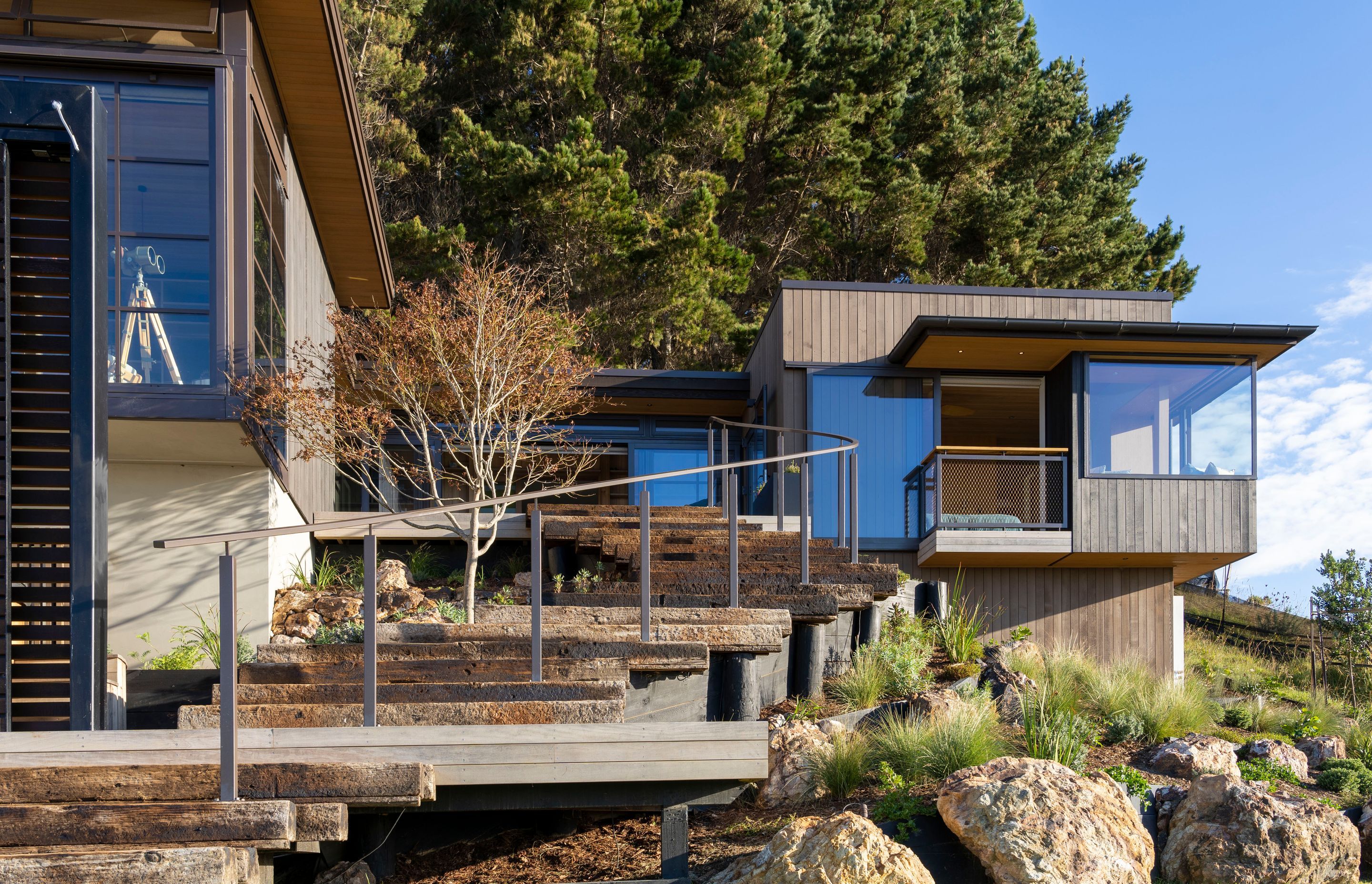 With no defined entrance, walkways connect to different sections of the home.