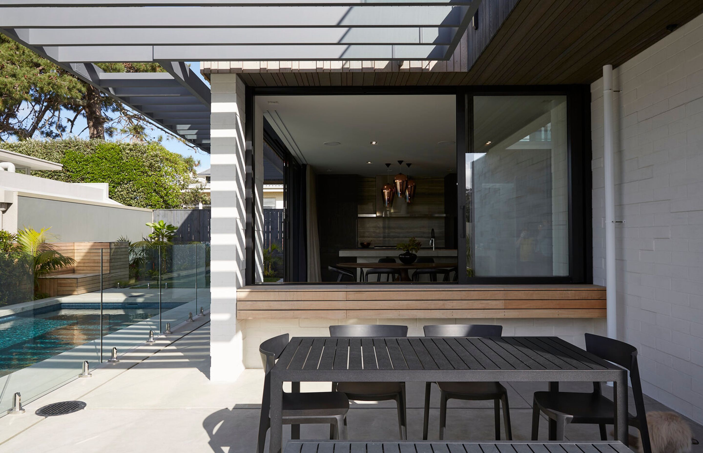 The outdoor area connects with the interior through a bar with window slider.