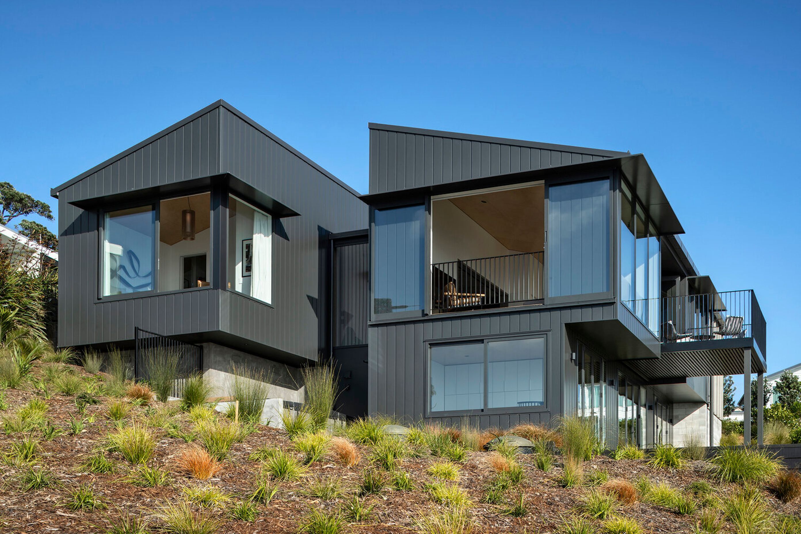 As seen from the rear of the property, the split cruciform nature of the design becomes apparent.