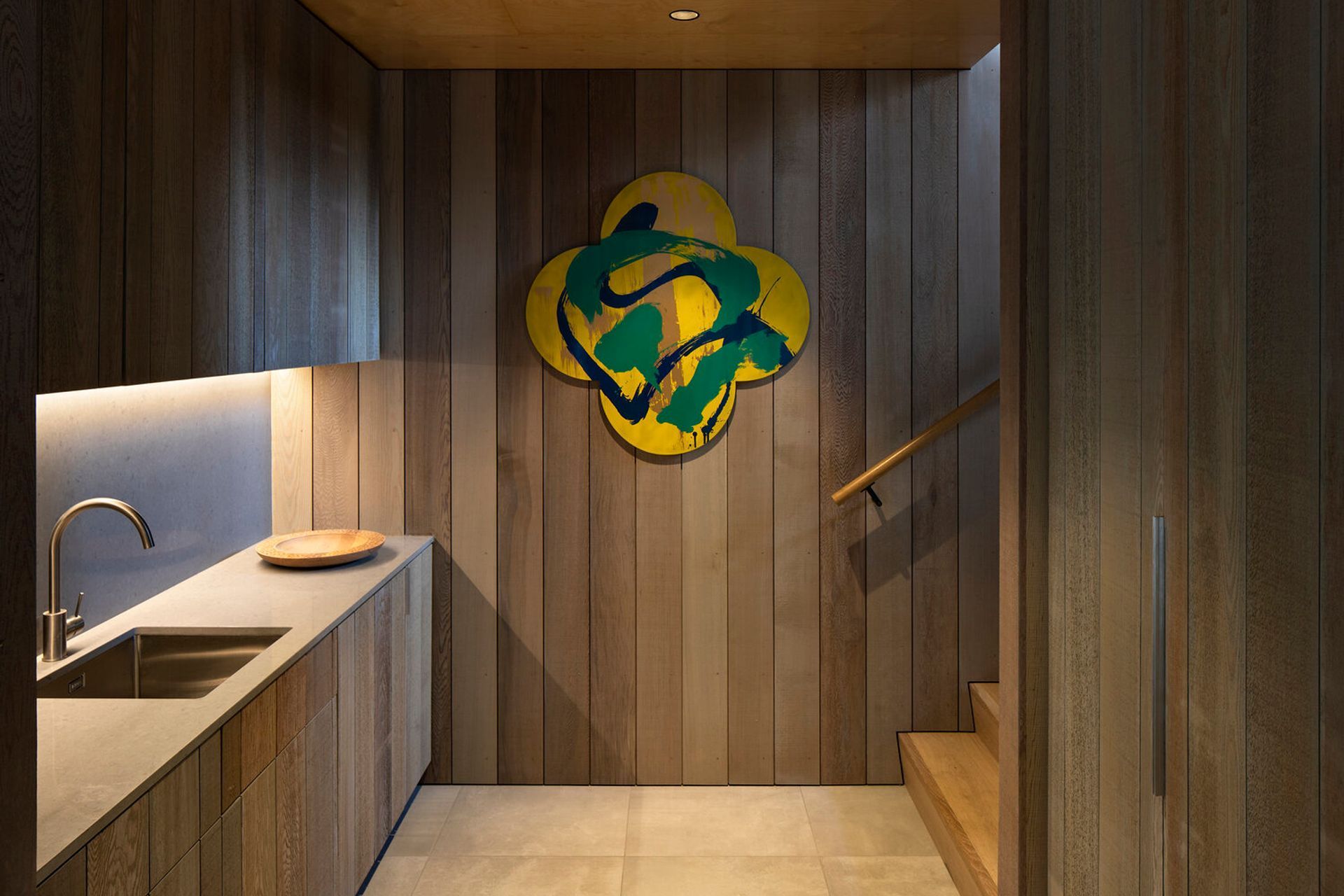 A kitchenette services the downstairs lounge and dining patio.  Two further bedrooms are also located on the lower level.