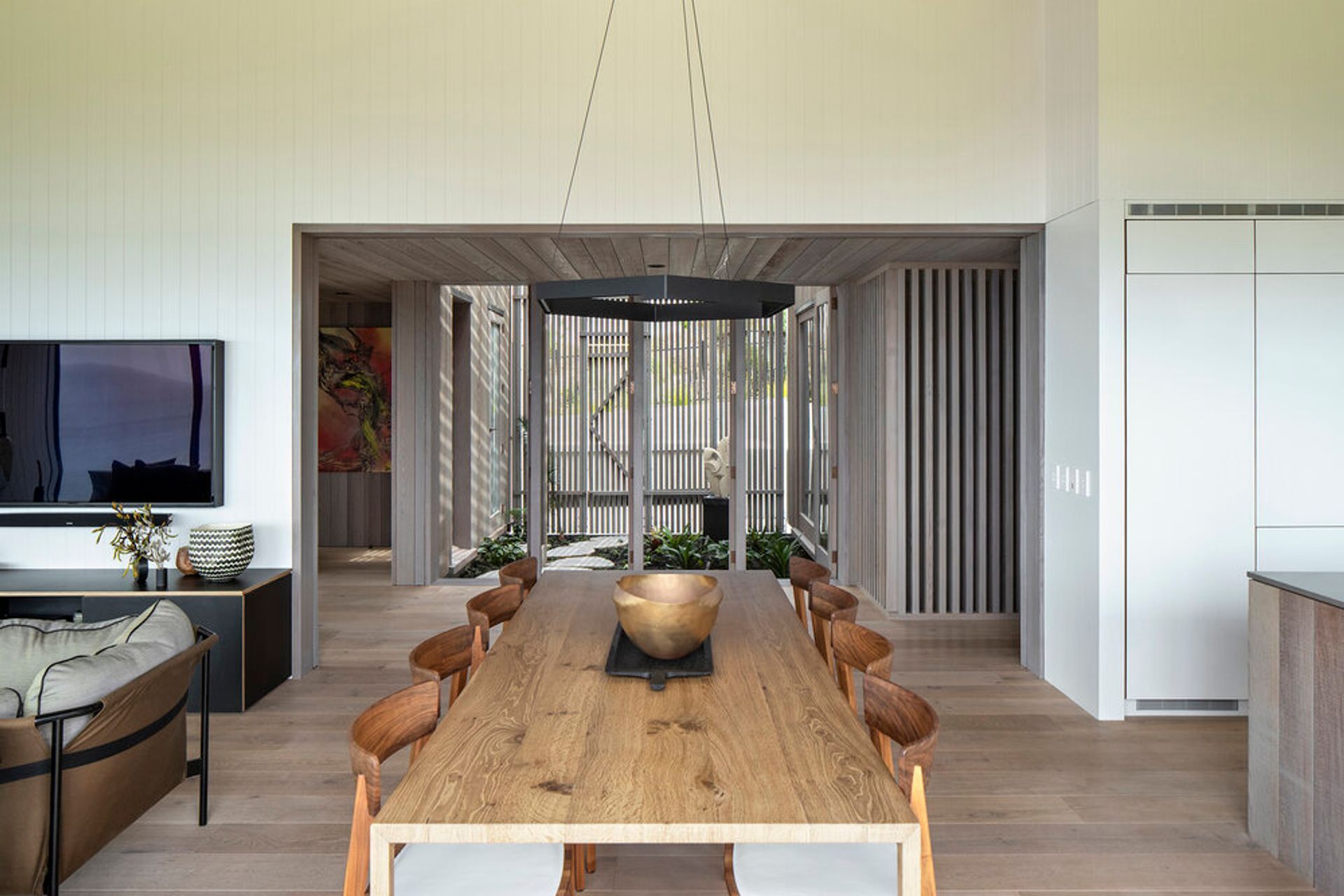 An internal courtyard provides cooled air flow, one of the passive environmental initiatives inherent in the home.