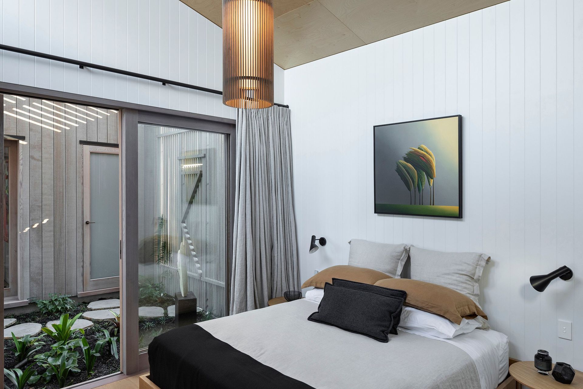 On the opposite side of the courtyard is a powder room, a quirky treatment of a standard feature.