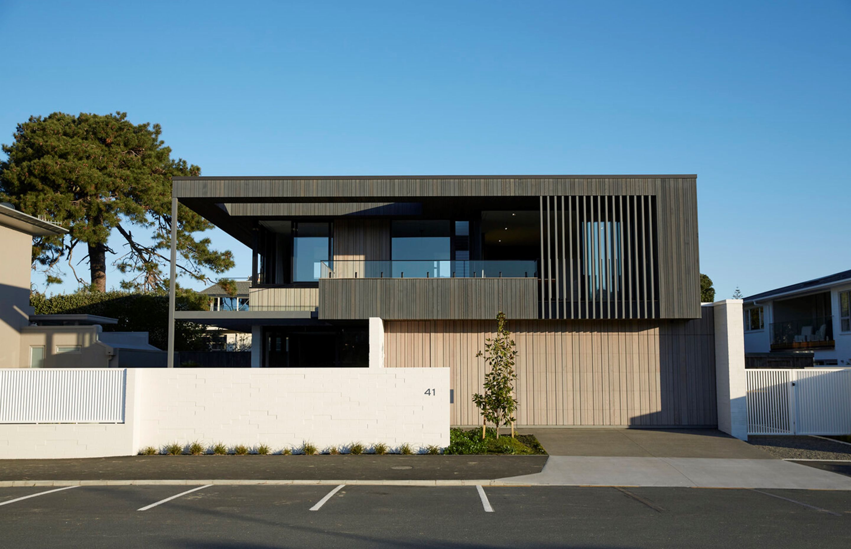 The home has a direct interface with the street and faces the public park.