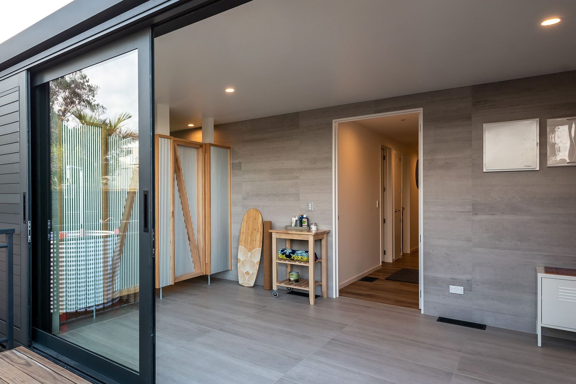 Wet room, a great space for getting out of your wet wetsuit and into the shower. Tiled with Timberland Light Gris 450x900mm