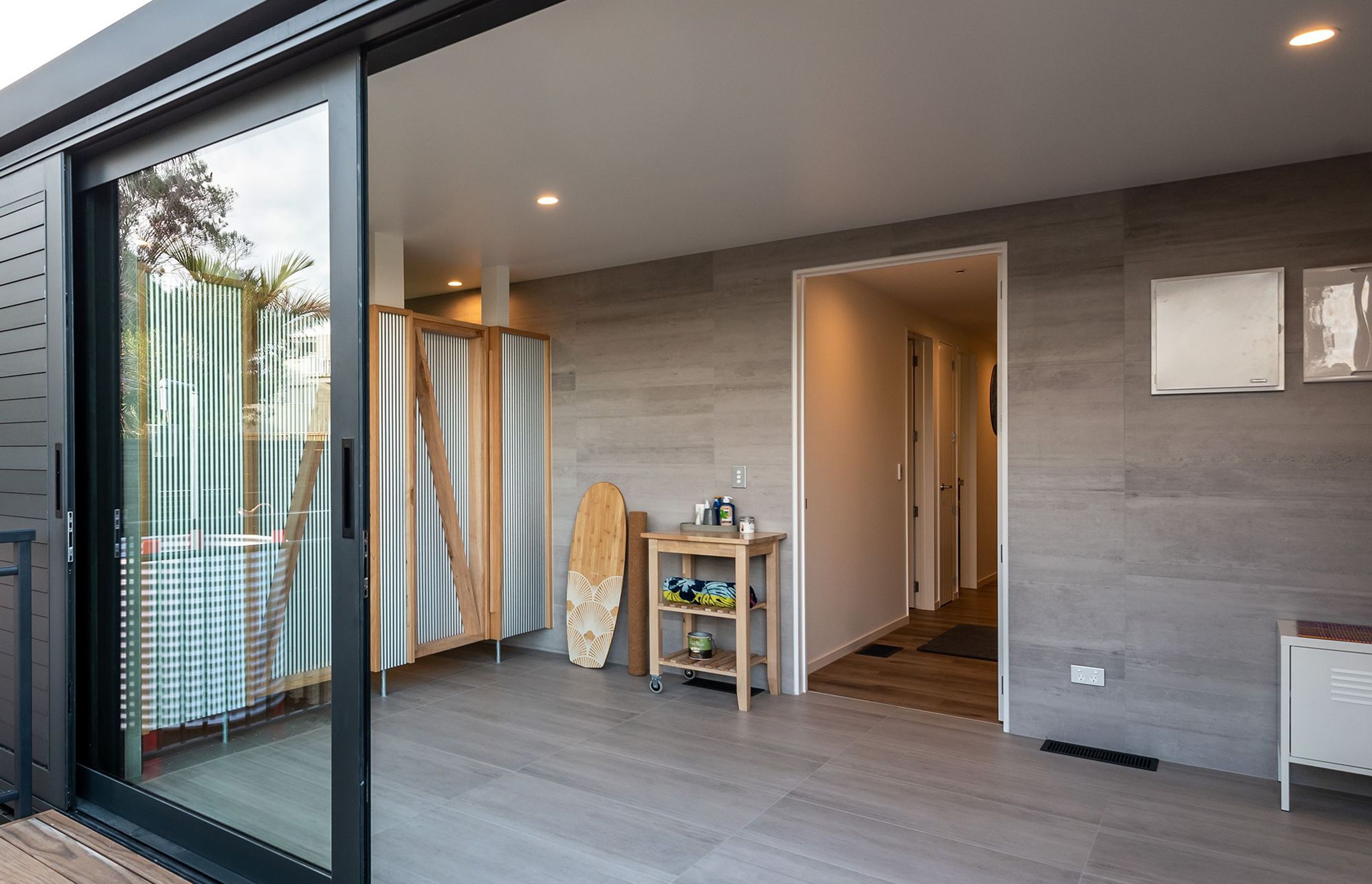 Wet room, a great space for getting out of your wet wetsuit and into the shower. Tiled with Timberland Light Gris 450x900mm