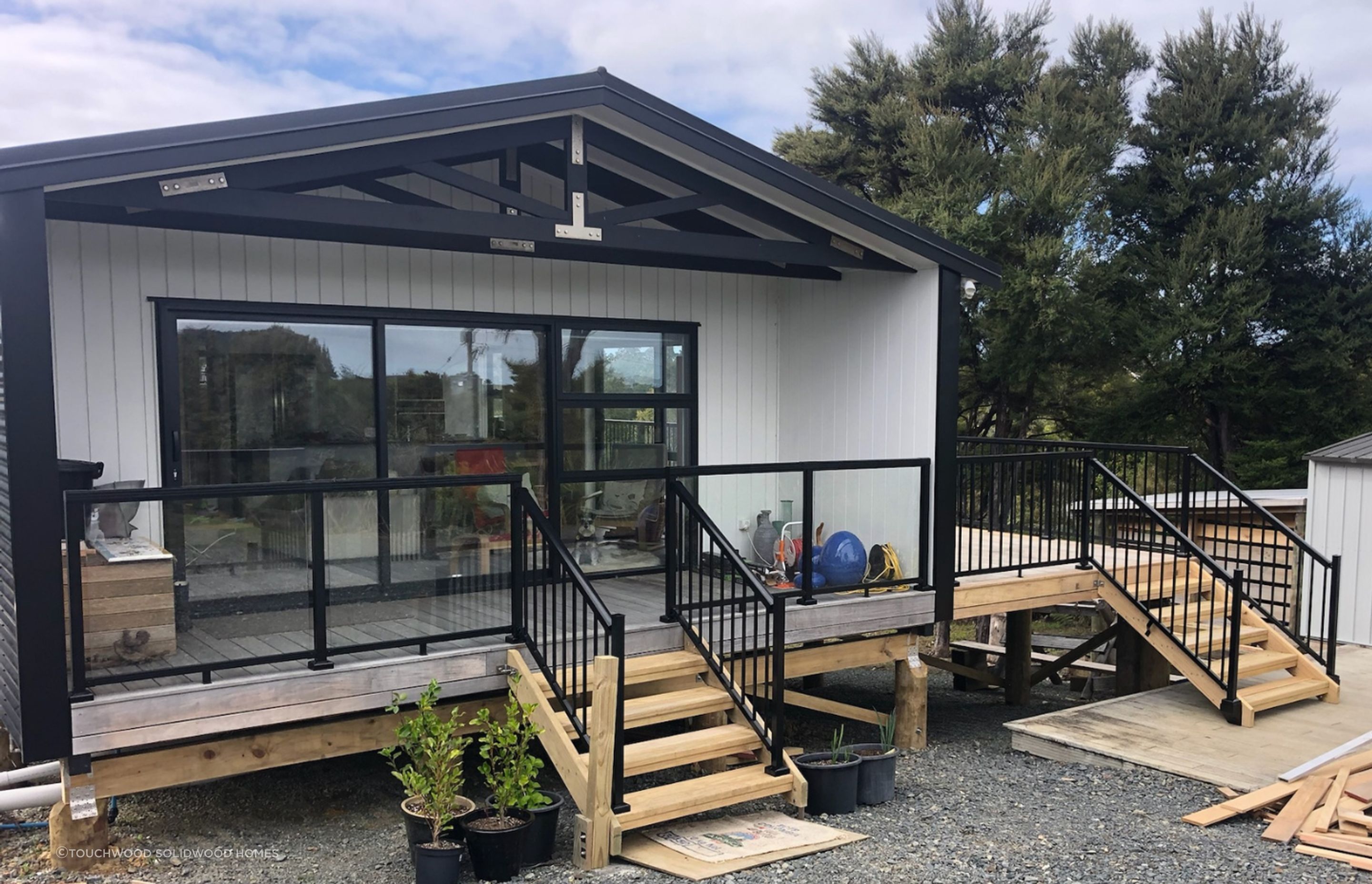 After being transported to site, the finishing touches for this home was additional side deck and handrails.