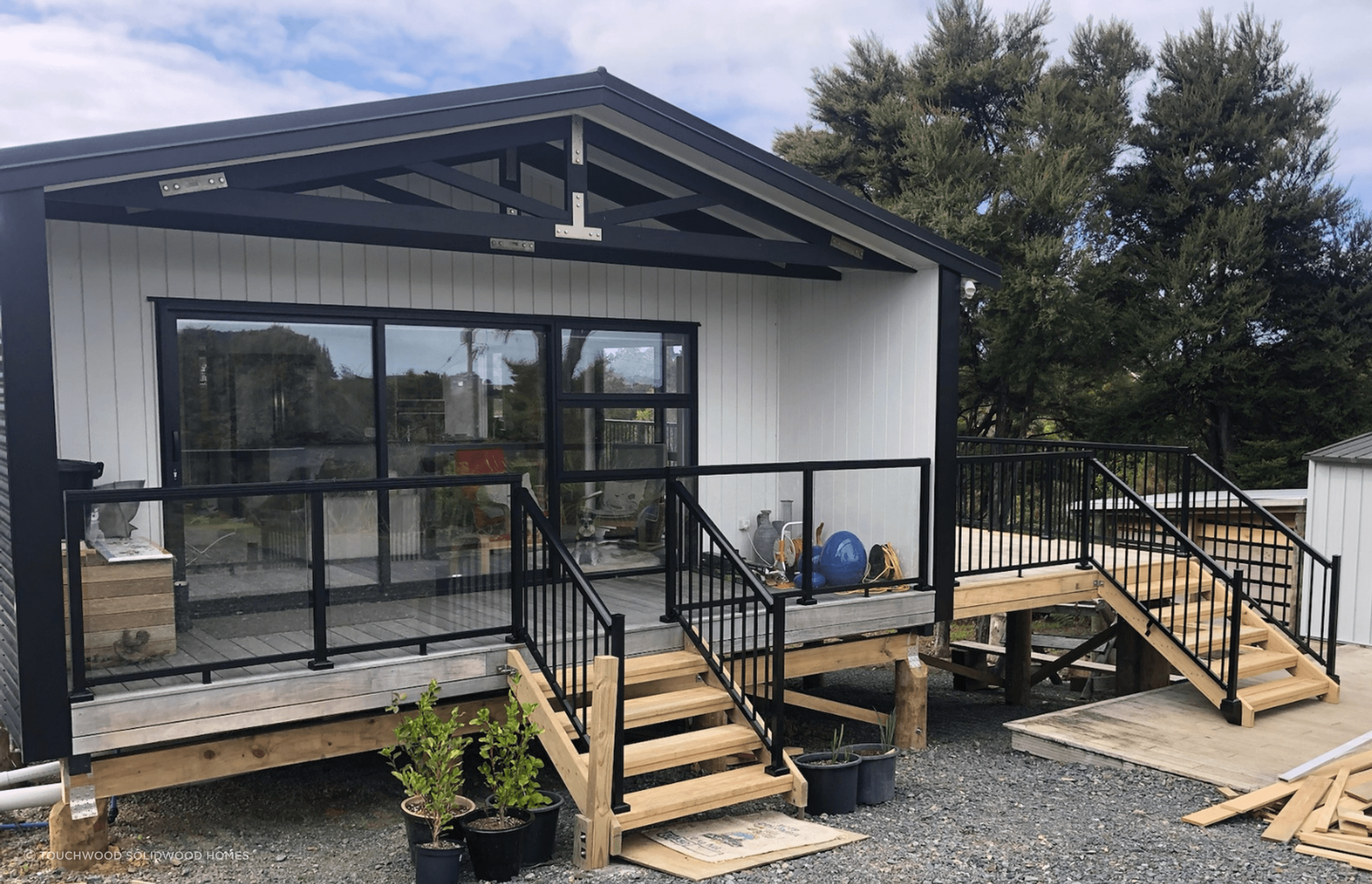 After being transported to site, the finishing touches for this home was additional side deck and handrails.