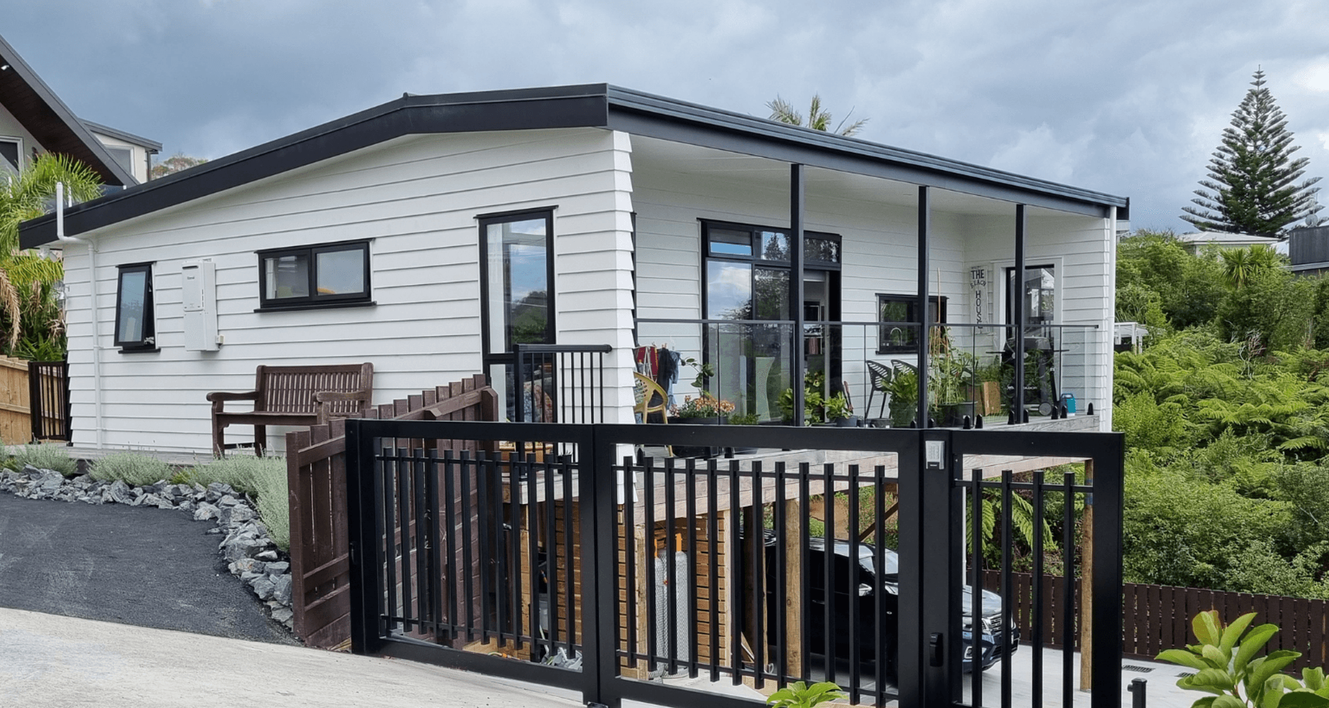 Dreamwood Series Plan 7 Onsite, with driveway, gate and landscaping completed.
