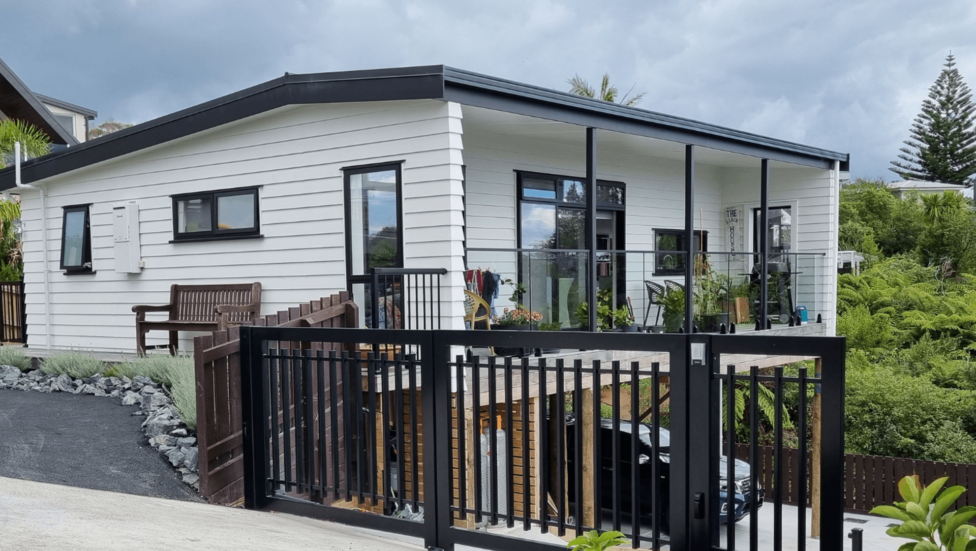 Dreamwood Series Plan 7 Onsite, with driveway, gate and landscaping completed.
