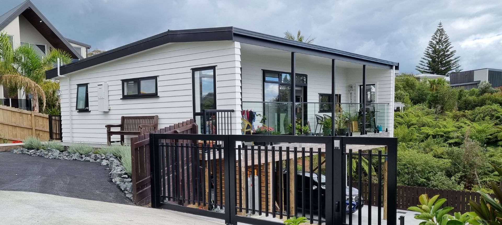 Dreamwood Series Plan 7 Onsite, with driveway, gate and landscaping completed.