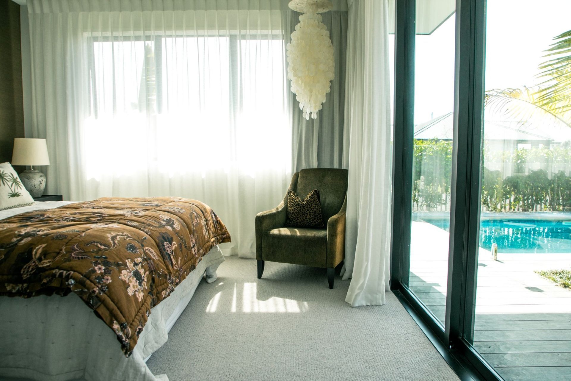 soft-bedroom-design-deck-to-pool-sheers-curtains-arcline-architecture.jpg