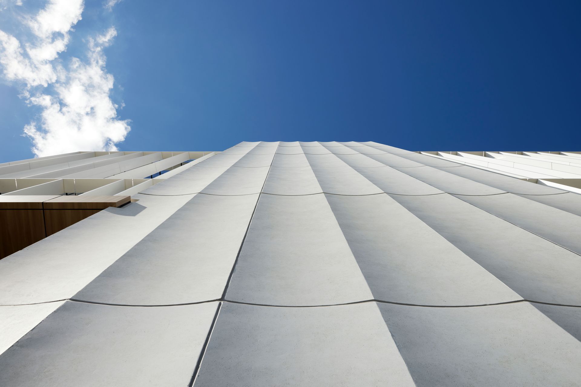 The fluted panels are precast concrete.