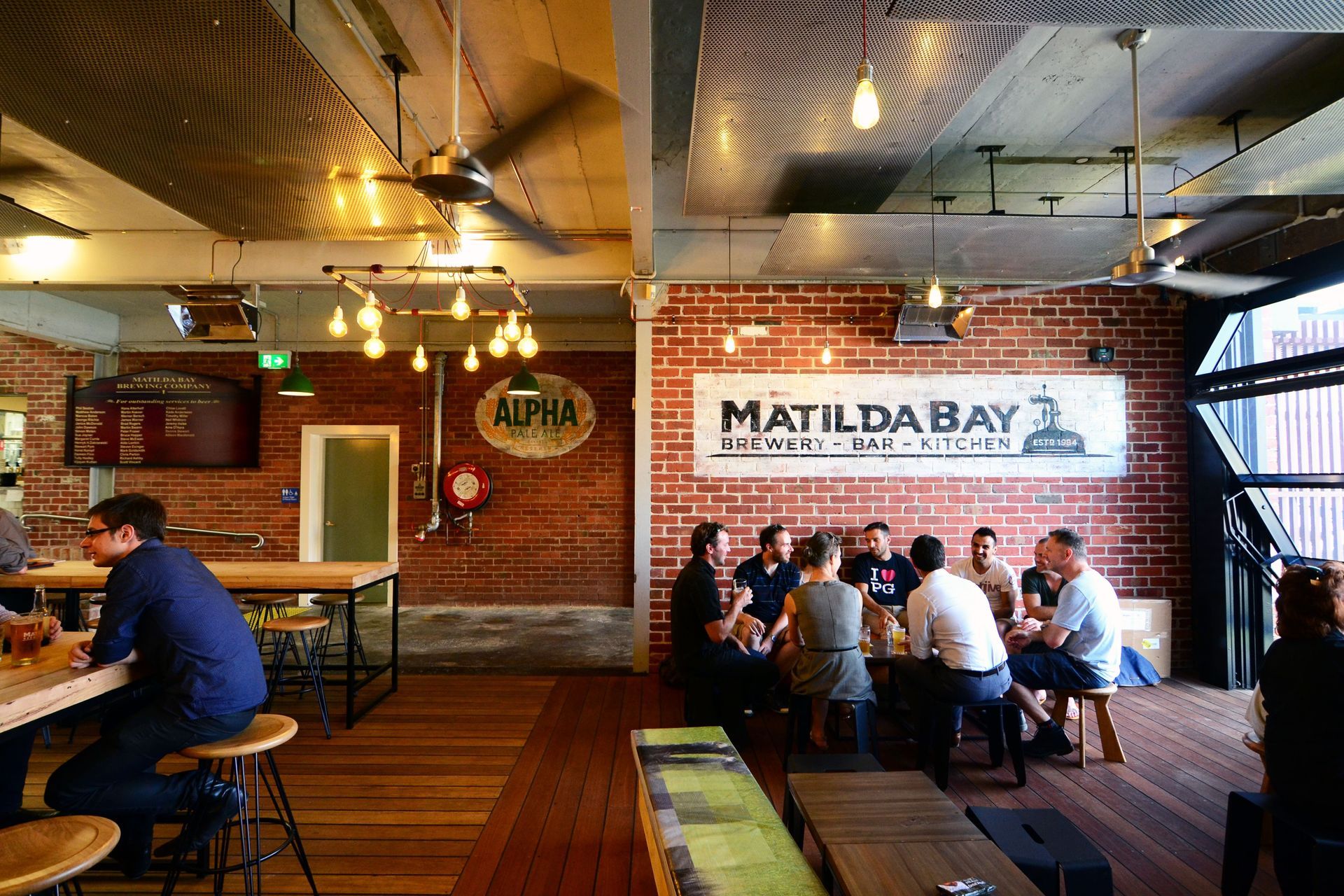 Brewery bar within working factory during the day.
