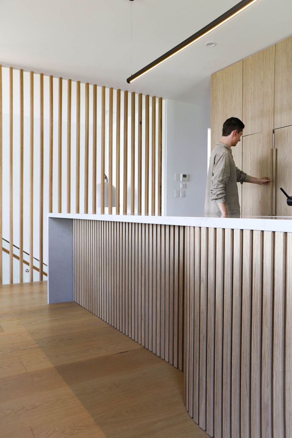 Shipp Residence - Kitchen. Timber battened island and integrated joinery.