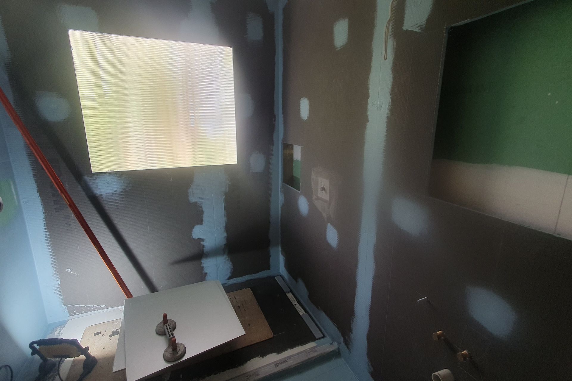 Wedi-board fitting. Wedi is a proprietary tile-backer board with waterproofing and insulation properties.