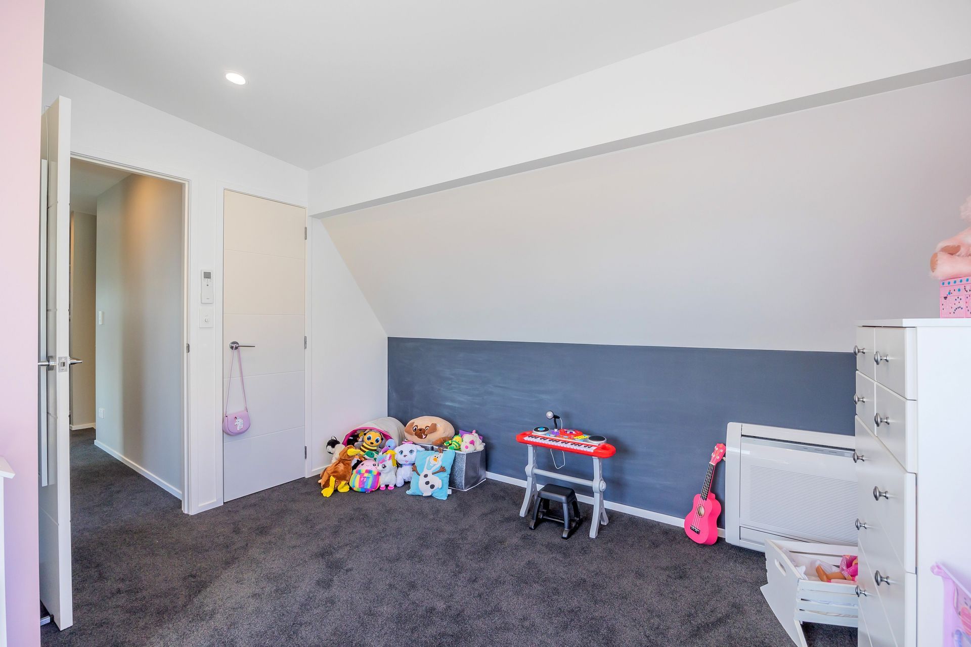 The addition of chalkboard paint on one of the walls sparks imagination and invites artistic expression. This interactive feature allows the young girl to unleash her creativity. The combination of pink walls and a chalkboard wall creates a harmonious balance between a serene sanctuary and a space for boundless self-expression. It fosters a sense of individuality, playfulness, and personal growth, making the bedroom a charming haven for the young girl to explore her artistic abilities and embrace her unique personality.