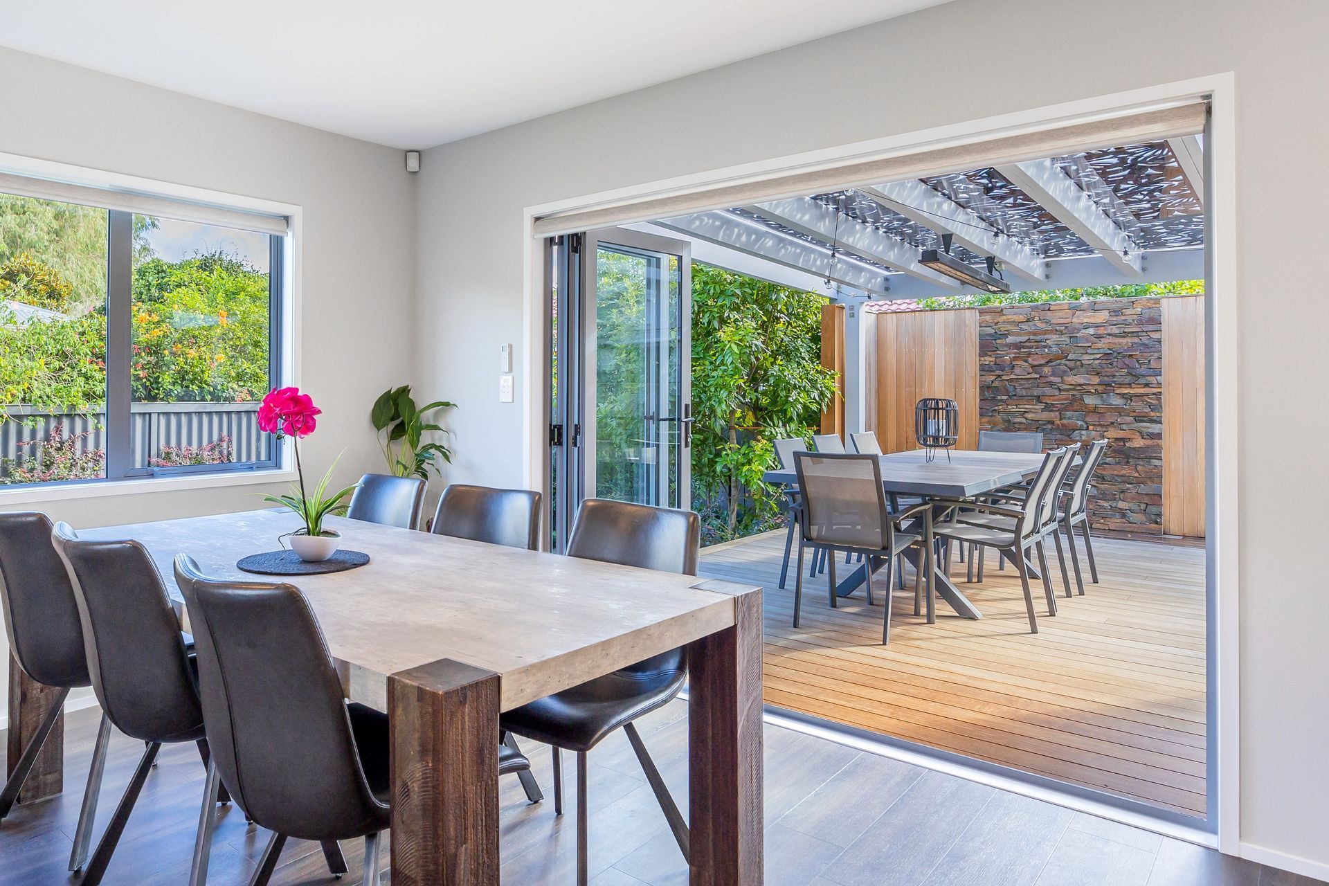 An open plan layout allows for seamless social interaction and connectivity between different areas of the home. By integrating the dining area with the living room and kitchen, it creates a unified space where family members and guests can gather, converse, and share meals together. This promotes a sense of togetherness and facilitates easy communication. Open plan living often aims to make the most of available space by eliminating unnecessary walls and barriers. By incorporating the dining area into the communal space, it optimizes the use of square footage. The absence of partitions creates a visually open and spacious environment, making the entire area feel larger and more expansive.