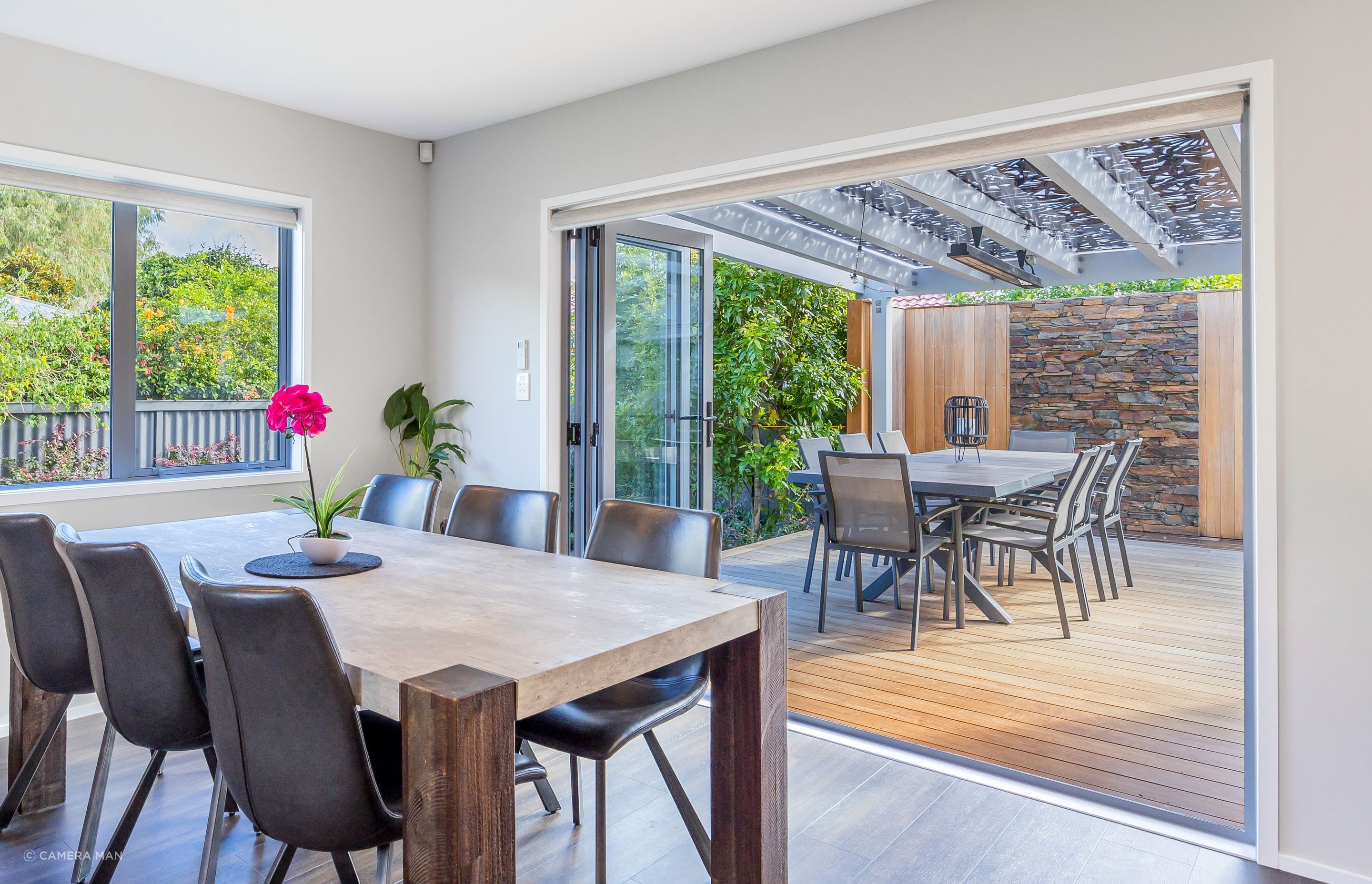 An open plan layout allows for seamless social interaction and connectivity between different areas of the home. By integrating the dining area with the living room and kitchen, it creates a unified space where family members and guests can gather, converse, and share meals together. This promotes a sense of togetherness and facilitates easy communication. Open plan living often aims to make the most of available space by eliminating unnecessary walls and barriers. By incorporating the dining area into the communal space, it optimizes the use of square footage. The absence of partitions creates a visually open and spacious environment, making the entire area feel larger and more expansive.