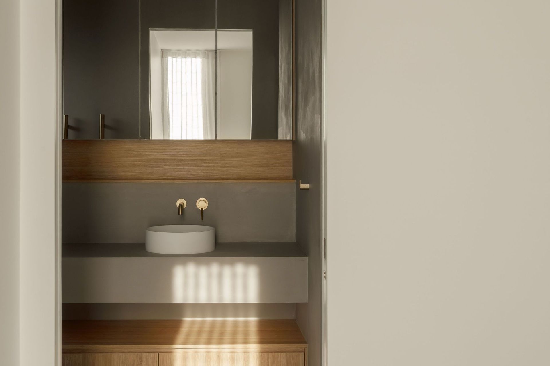 Gilbert Residence - Bathroom. Floating vanity with a vessel basin and mirror.