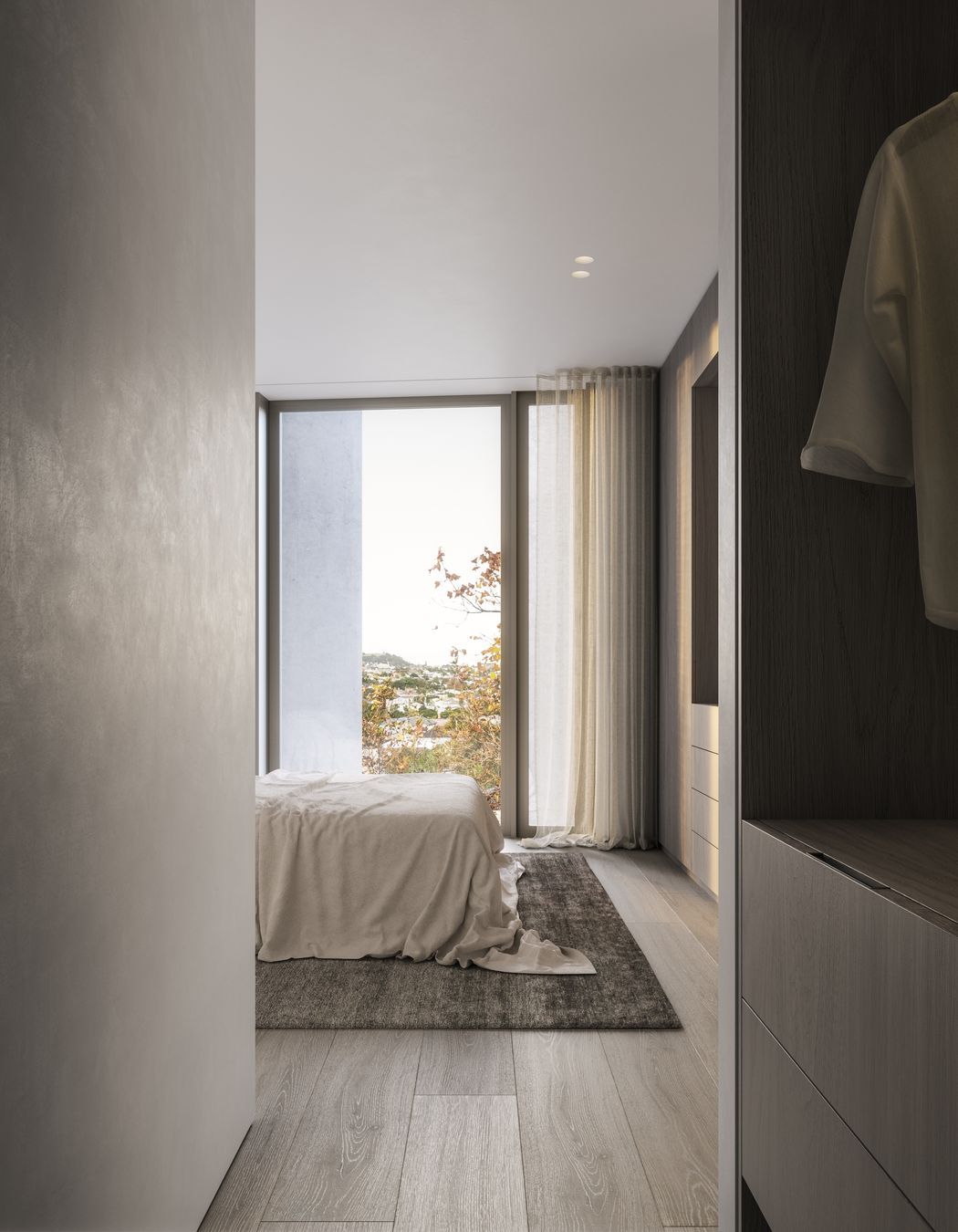Stained-oak cabinetry and rendered walls compliment one another and bring a tactile sense of luxury to each apartment.