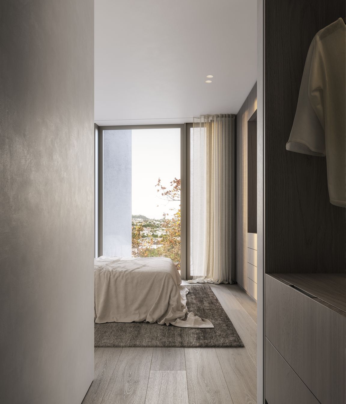 Stained-oak cabinetry and rendered walls compliment one another and bring a tactile sense of luxury to each apartment.