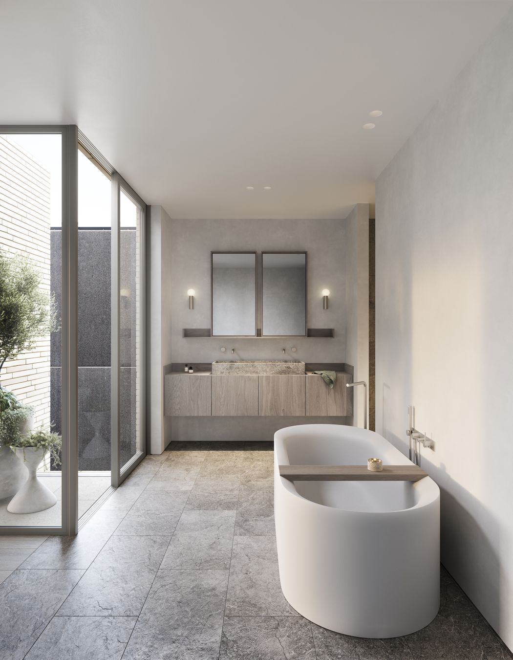Tumbled marble tiles and carved stone basins imbue bathrooms with an elegant tactility.
