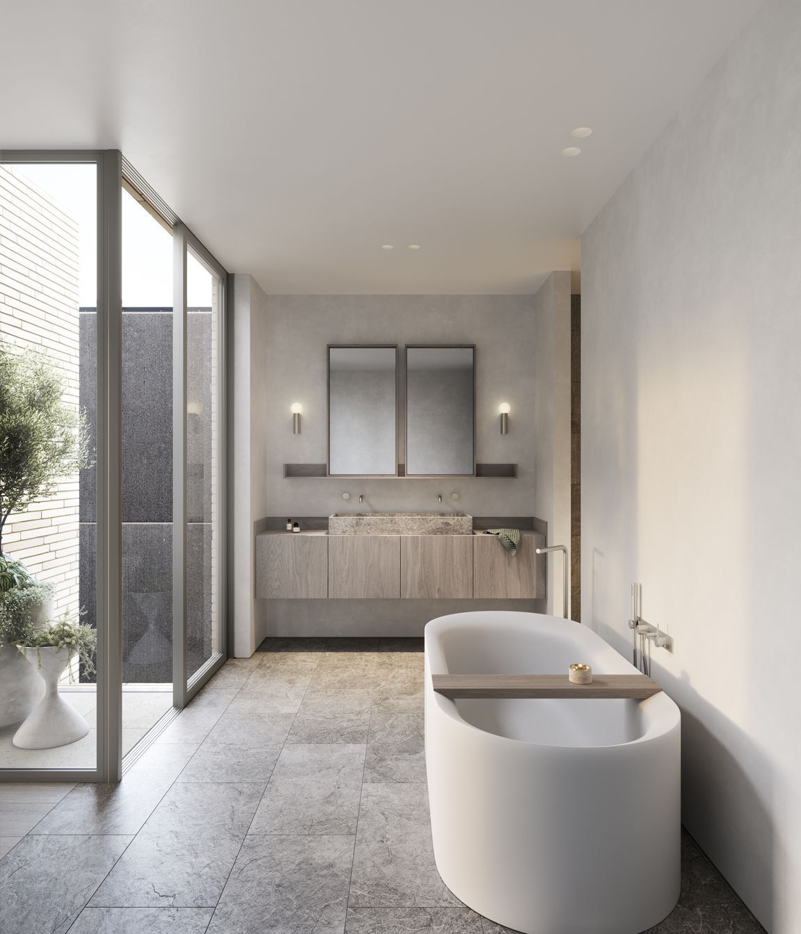 Tumbled marble tiles and carved stone basins imbue bathrooms with an elegant tactility.