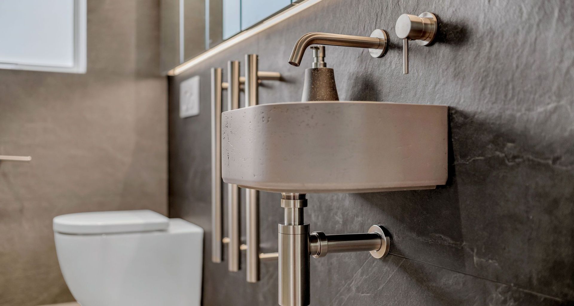 This bathroom went from dated to designer with high-end materials, precision installation, and a layout that just works.