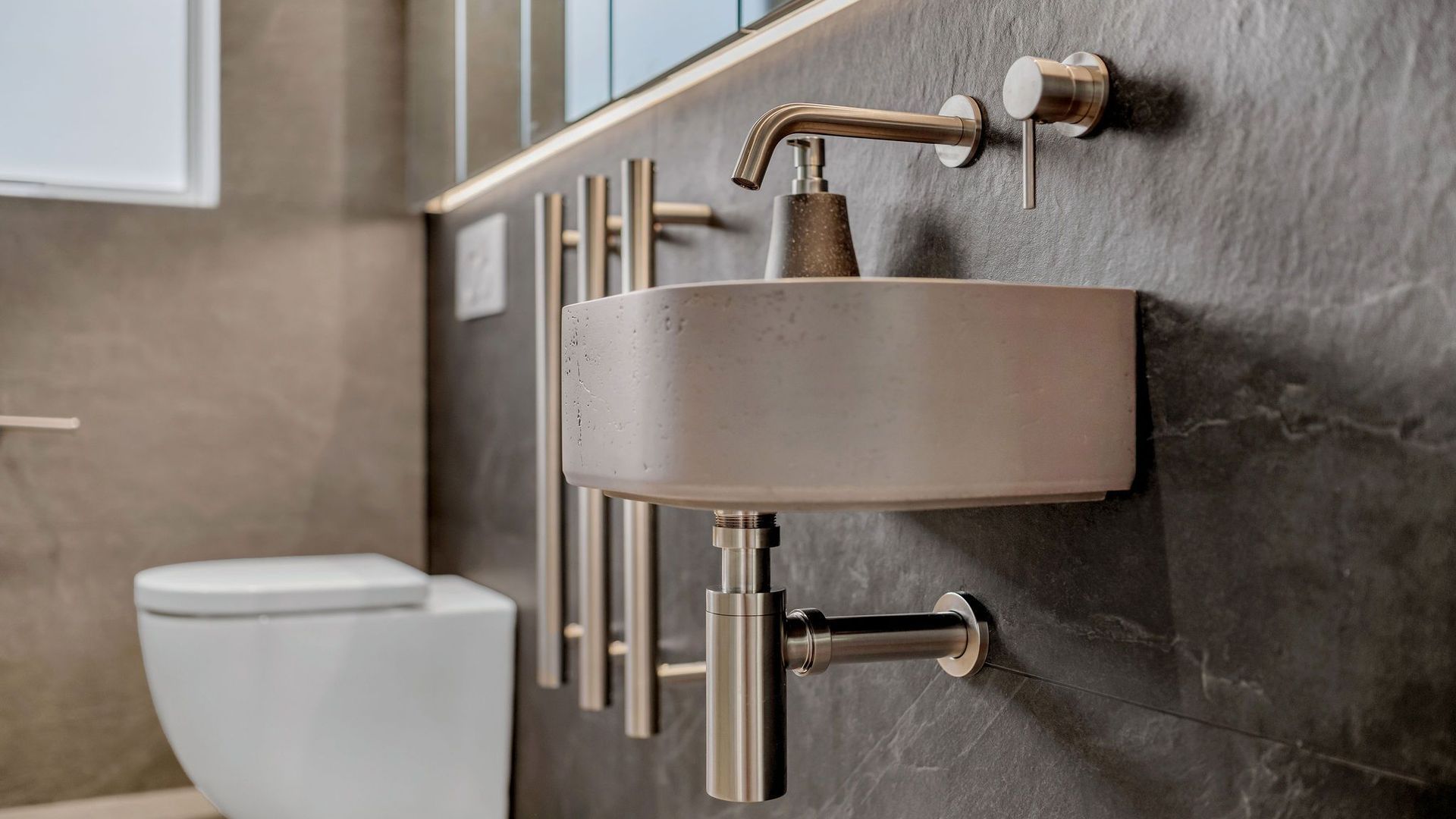 This bathroom went from dated to designer with high-end materials, precision installation, and a layout that just works.