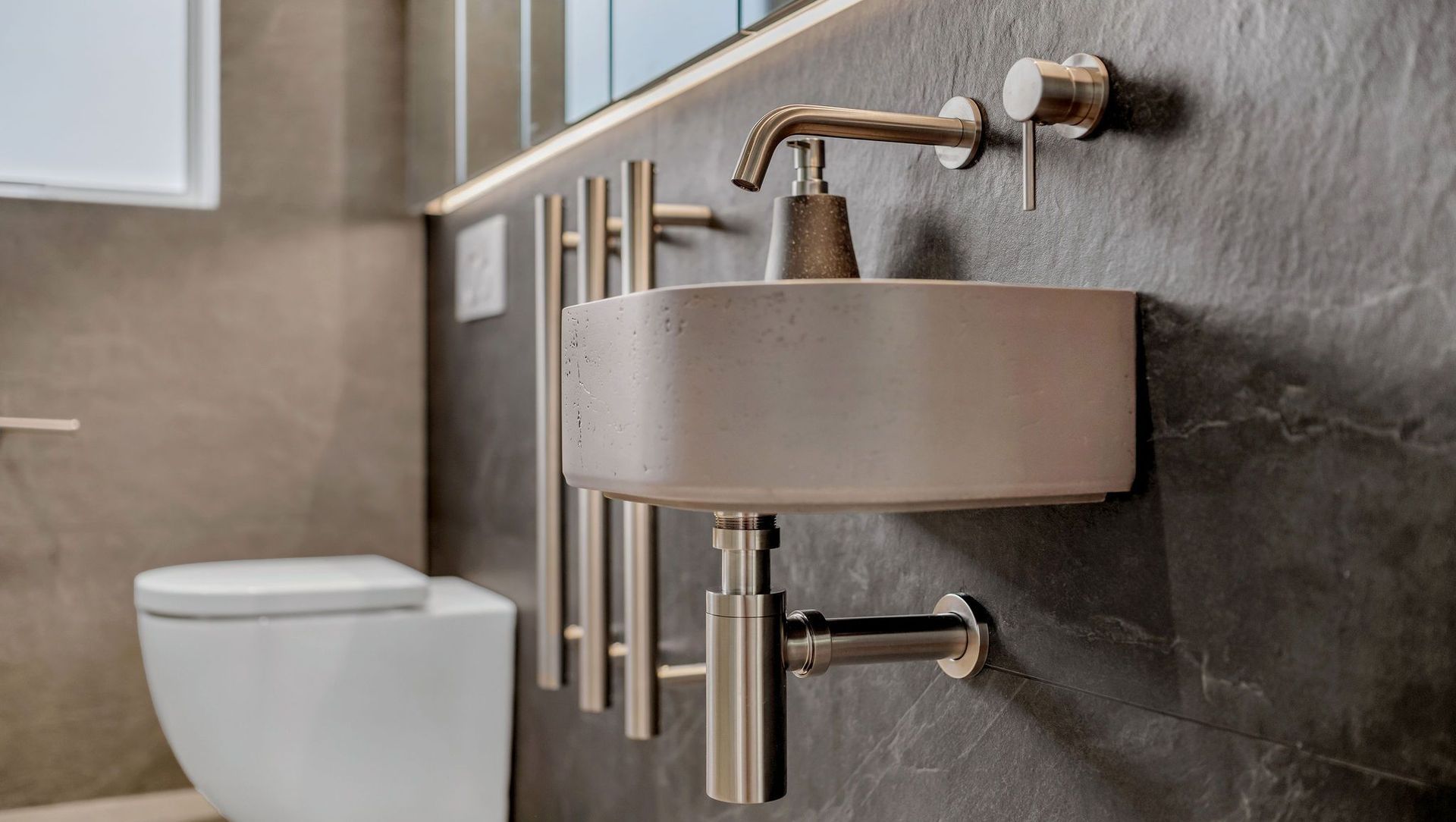 This bathroom went from dated to designer with high-end materials, precision installation, and a layout that just works.