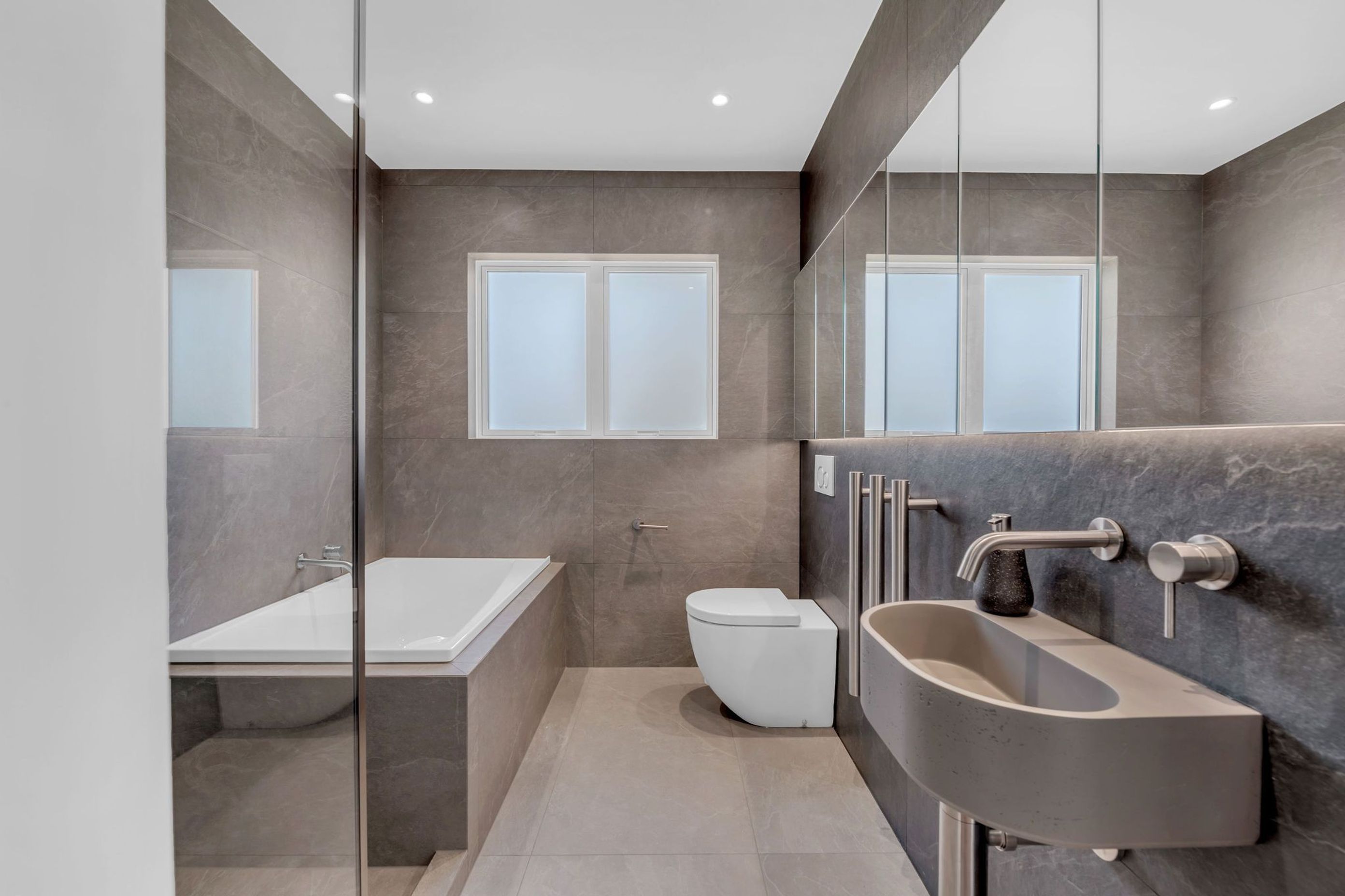 This bathroom is a perfect example of practical design that doesn’t compromise on aesthetics.