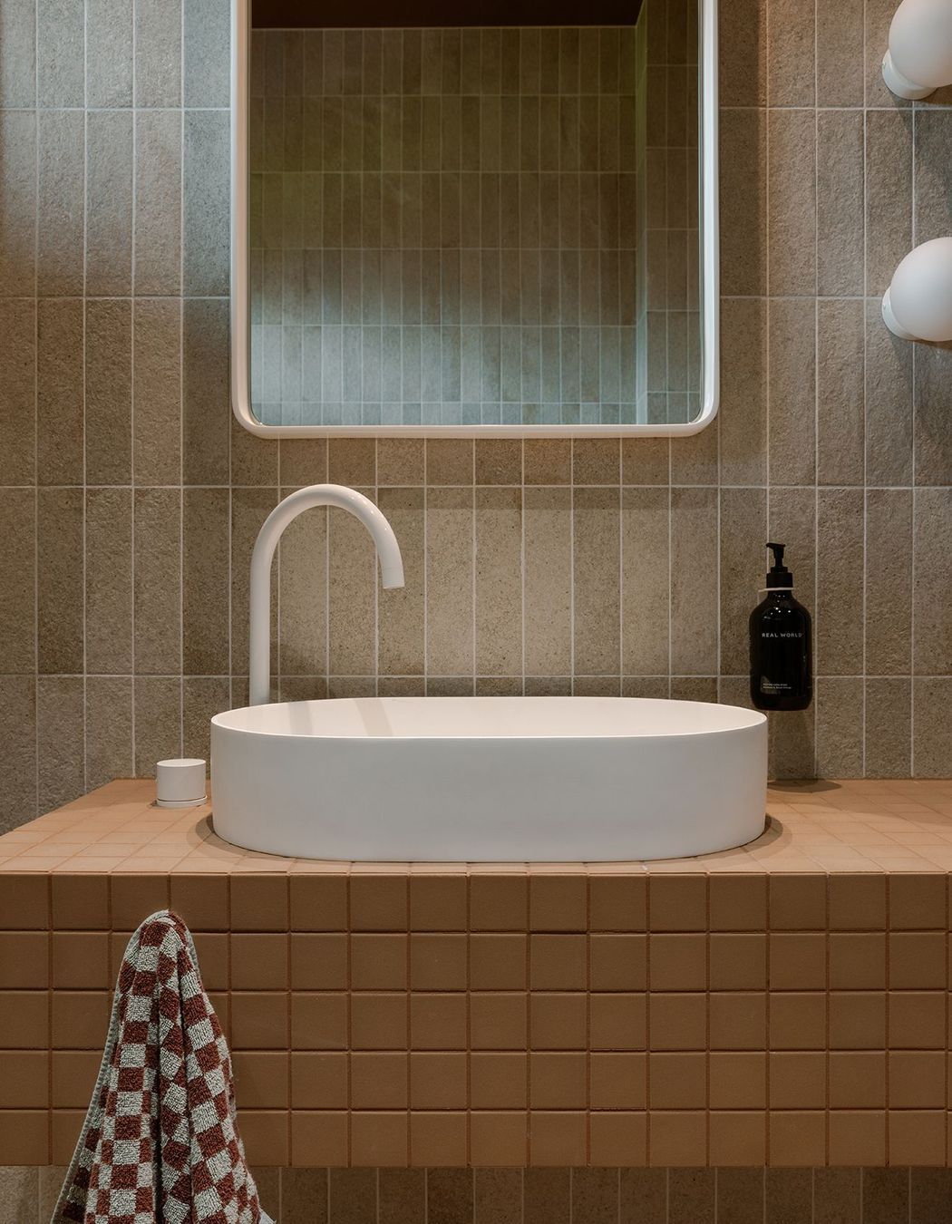 Whananaki Beach Retreat / Alex Walls, Walls Studio / Ensuite Walls: Fornace Argilla Naturale 60x240mm Custom Vanity and floor : Terra Cappi Mosaic