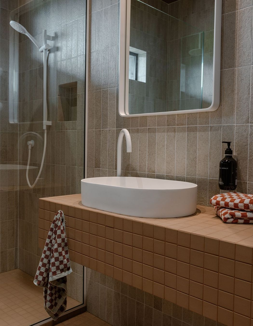 Whananaki Beach Retreat / Alex Walls, Walls Studio / Ensuite Walls: Fornace Argilla Naturale 60x240mm Custom Vanity and floor : Terra Cappi Mosaic