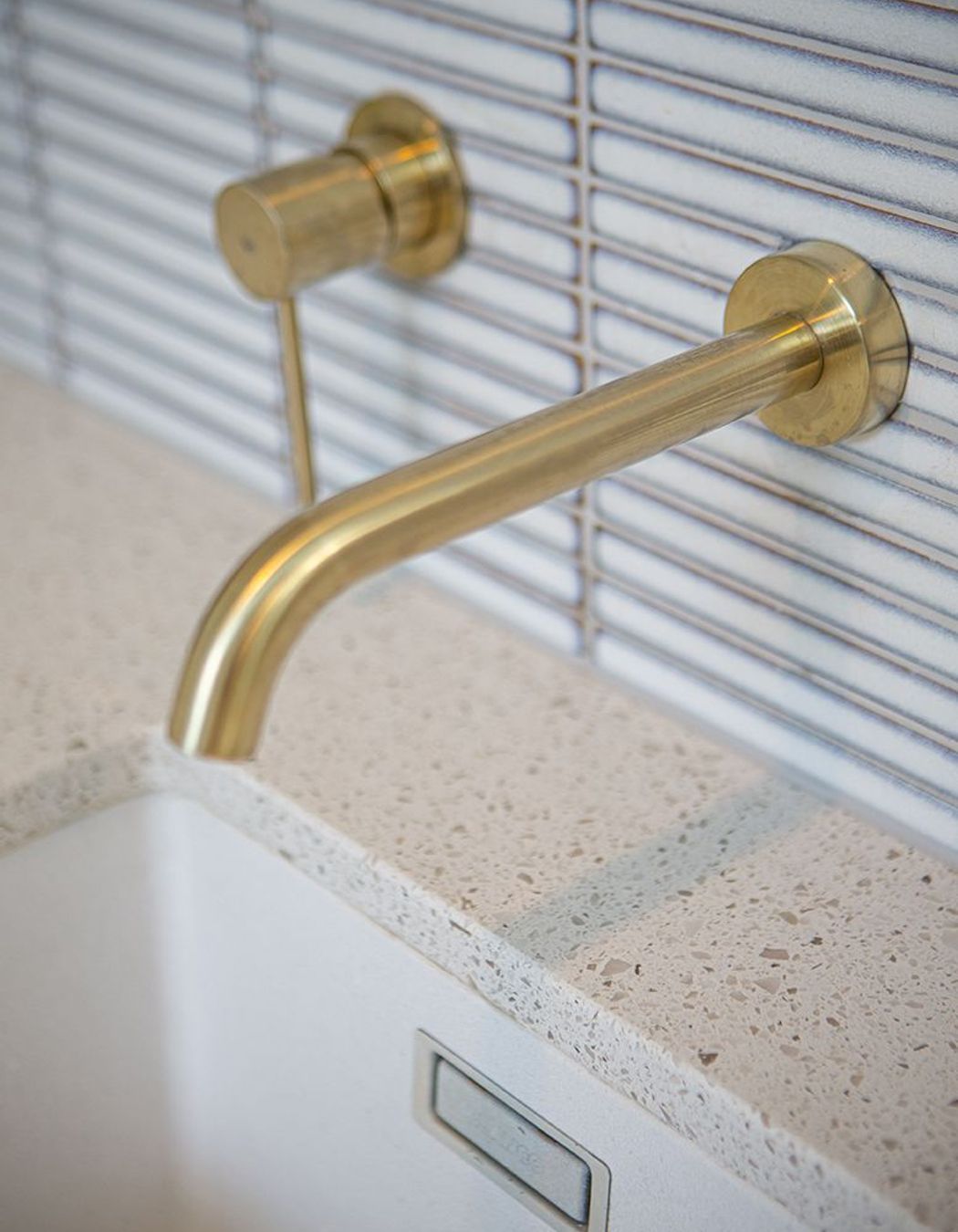 Beautiful and practical detailing at the sink, including perfect placement of the tiles and tapware.
