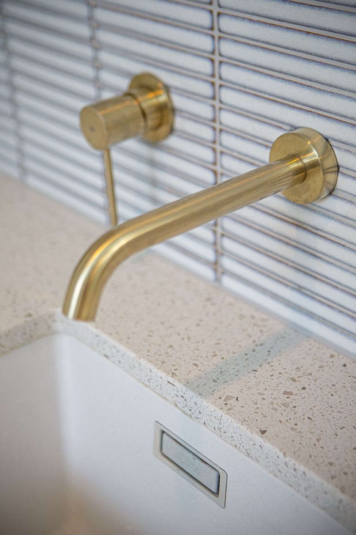 Beautiful and practical detailing at the sink, including perfect placement of the tiles and tapware.