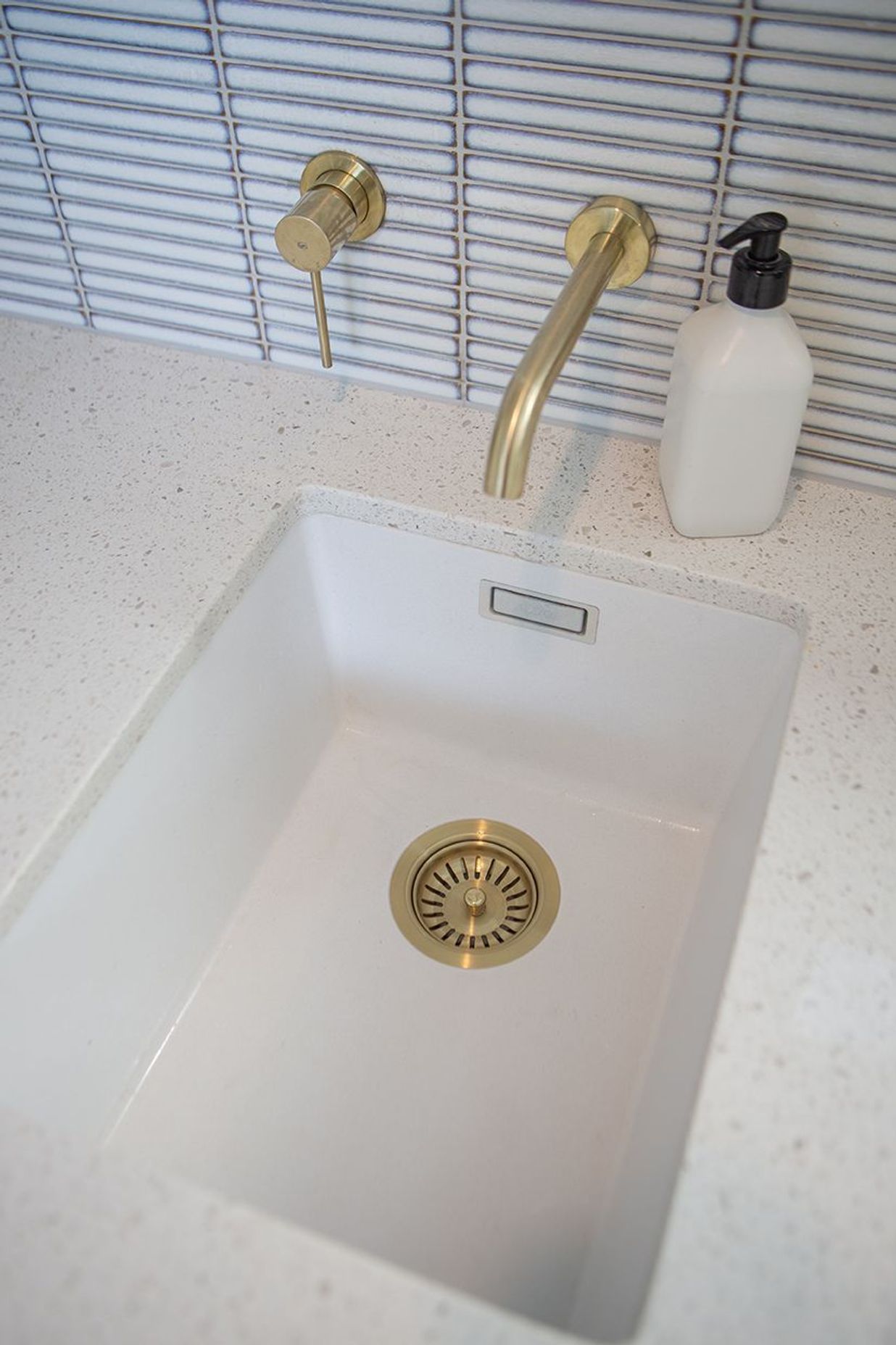 Brass fittings, including the waste. The Blanco Silgranite sink can also take a small bucket, or can be used for soaking.