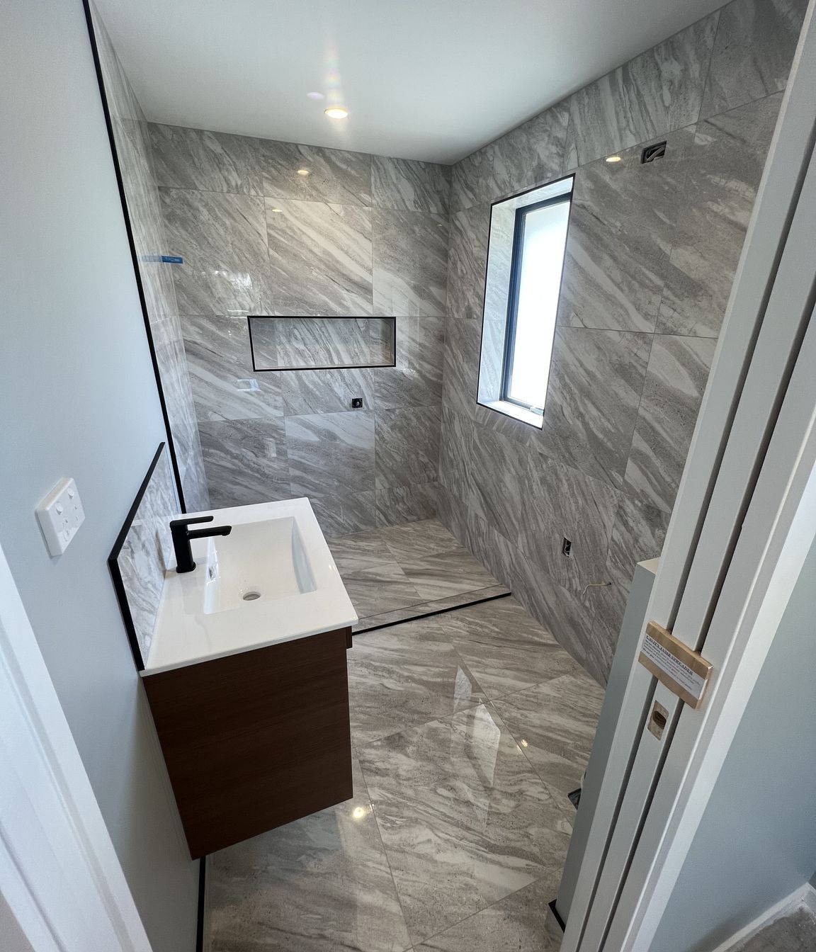 Tiled bathroom floor &amp; shower walls