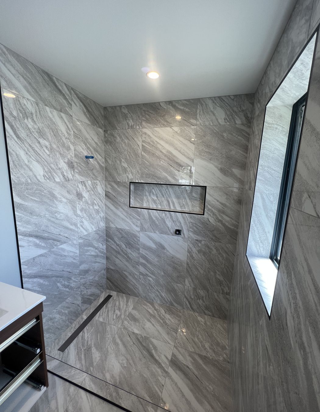 Tiled bathroom floor & shower walls