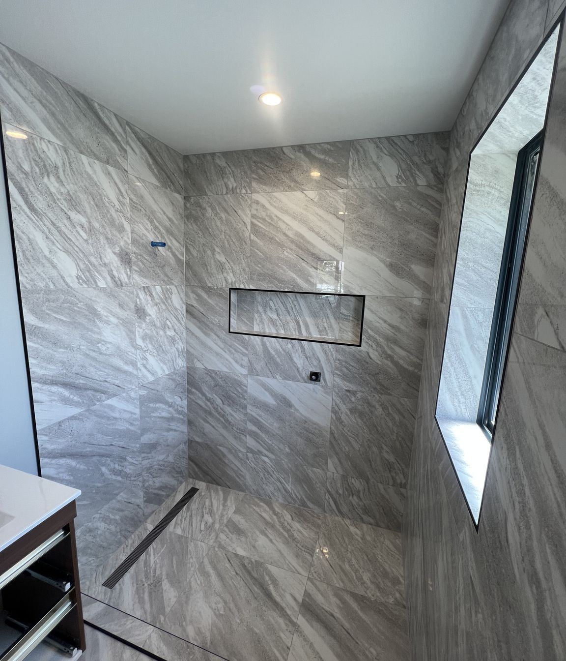 Tiled bathroom floor &amp; shower walls