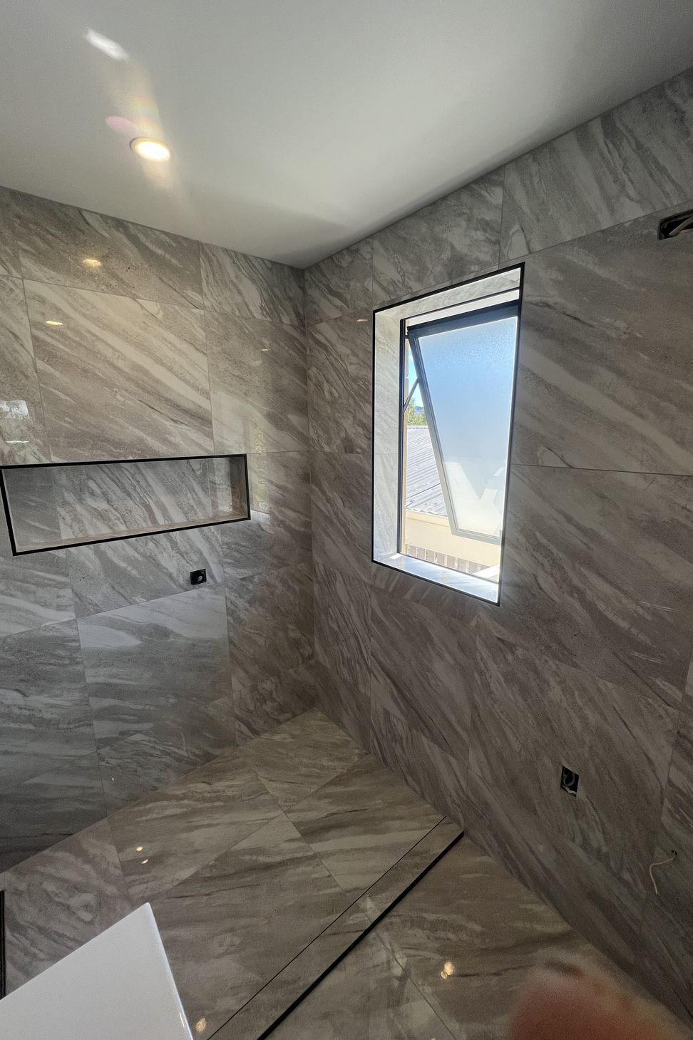 Tiled bathroom floor &amp; shower walls
