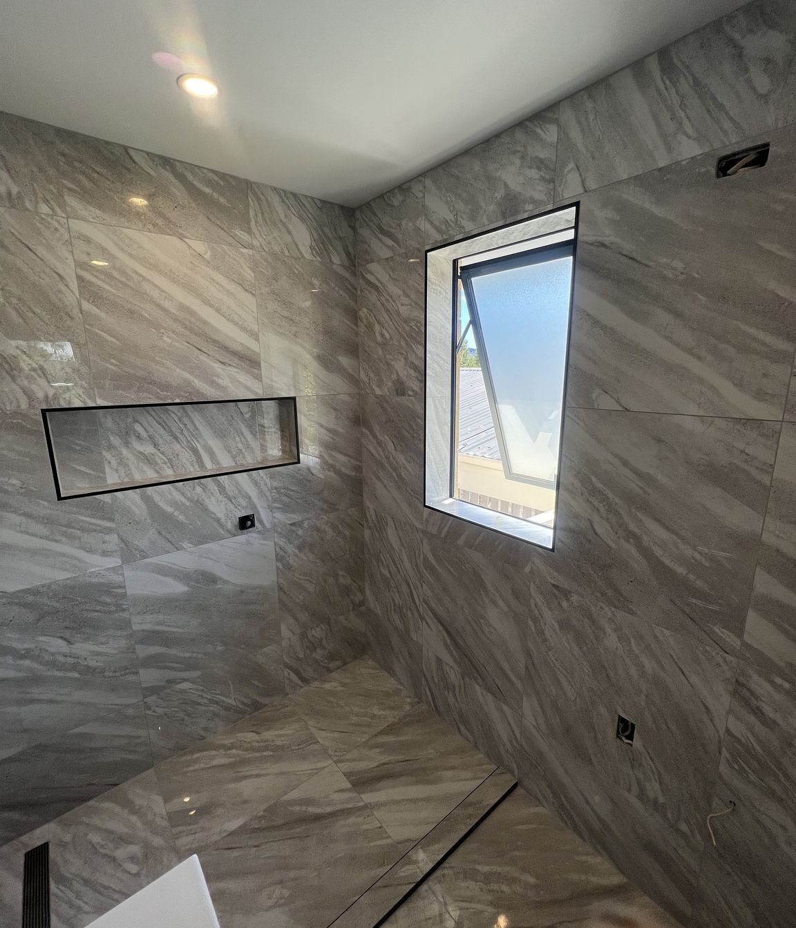 Tiled bathroom floor &amp; shower walls