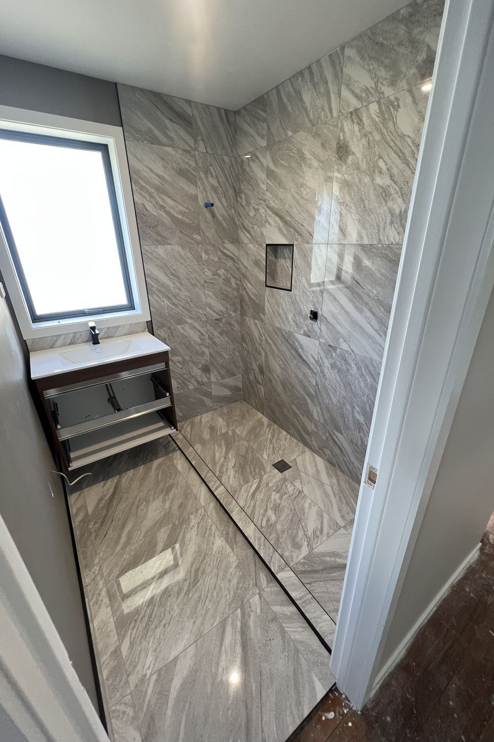 Tiled bathroom floor &amp; shower walls