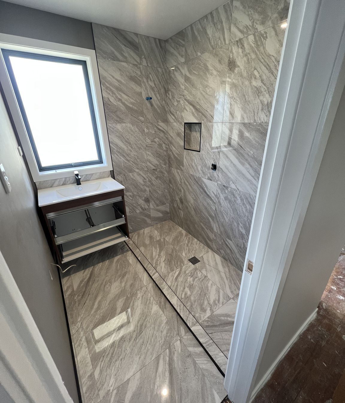 Tiled bathroom floor &amp; shower walls