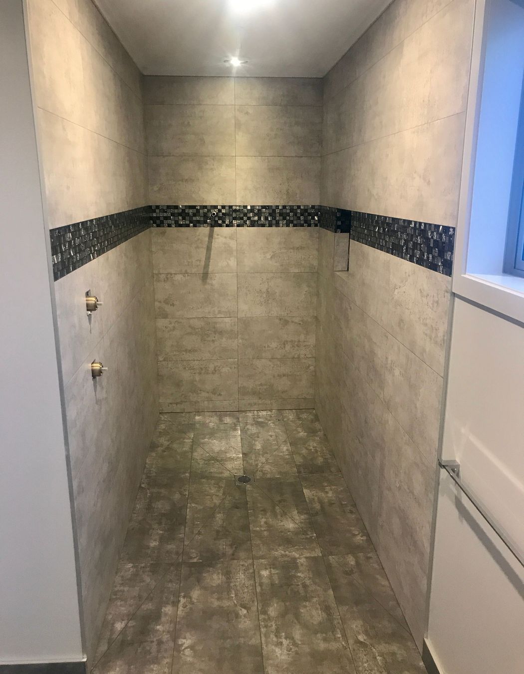 Tiled shower wall &amp; floors