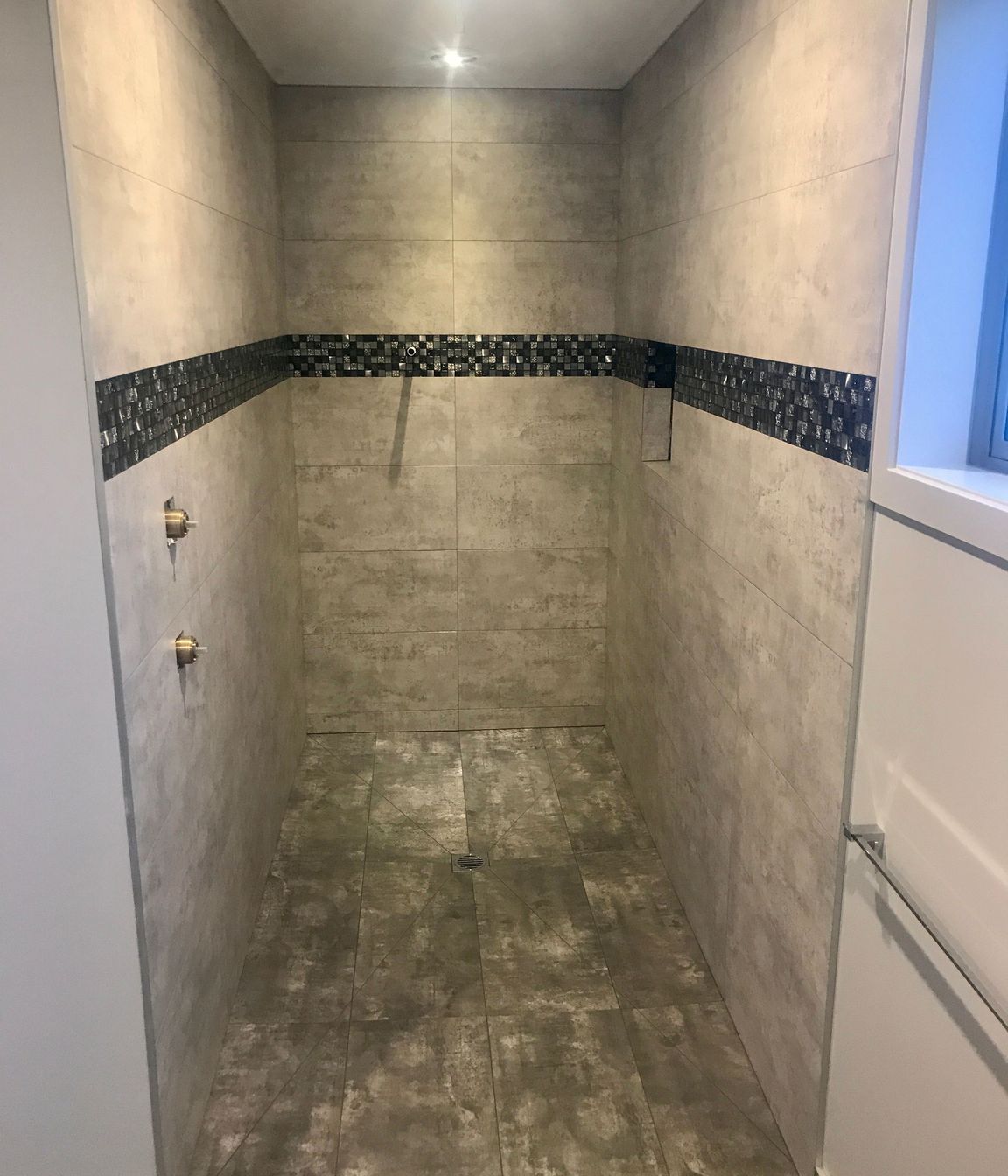 Tiled shower wall &amp; floors