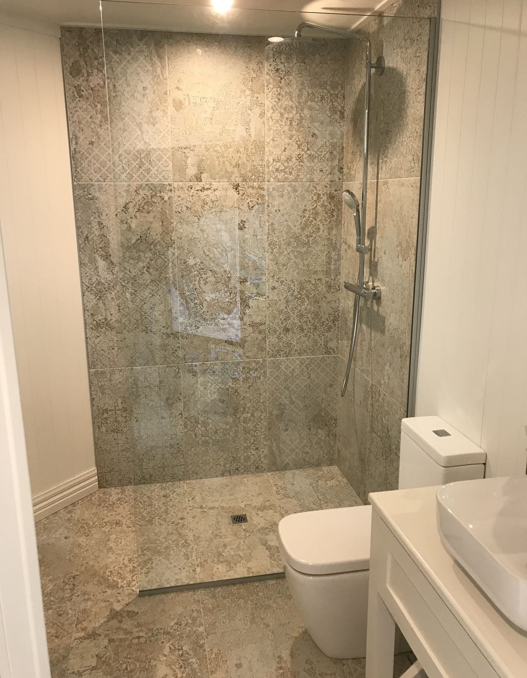 Tiled bathroom floor & shower walls