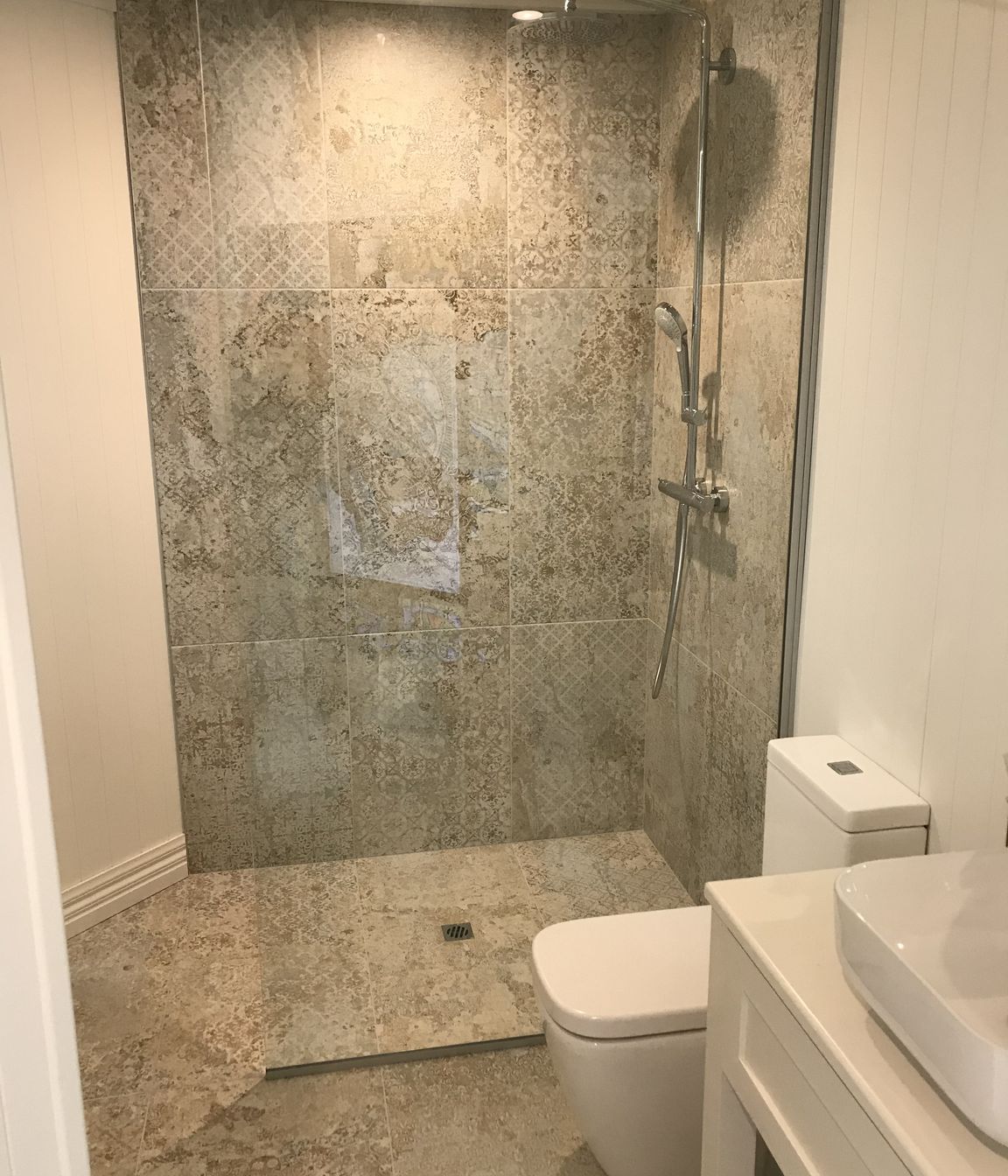 Tiled bathroom floor &amp; shower walls