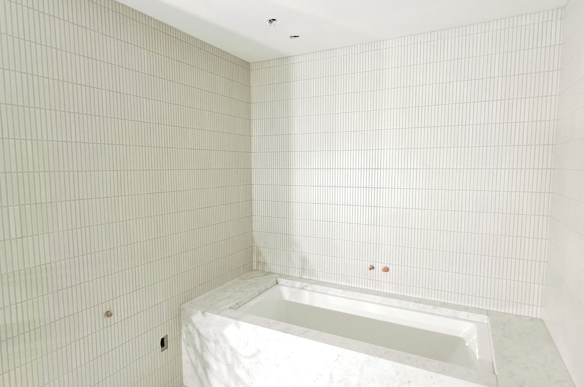 Damn Good Tiling - finger mosaic wall